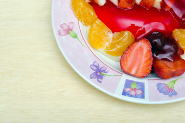 Strawberry jelly dessert flavored with half piece of strawberry,