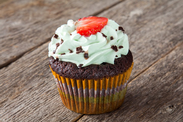 Cupcake with strawberry on top