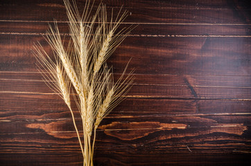 Barley grain on wooden table