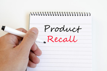 Human hand over wooden background and product recall text concep