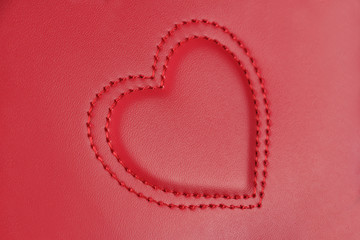 convex embroidery in shape of two hearts on pink leather, side v