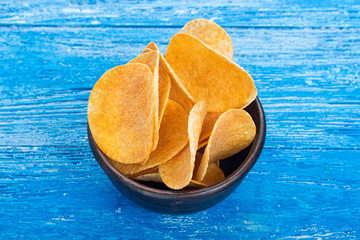 potato chips in a clay plate