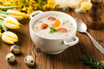 Traditional Polish white borsch with Easter decoration