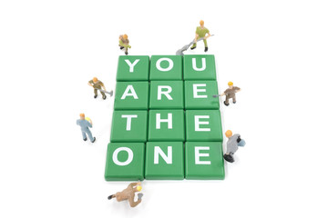 Miniature worker team building word You are the one on white background
