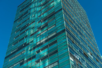 big blue and green colored skyscraper