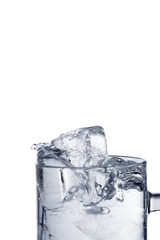Ice in glass on white background.