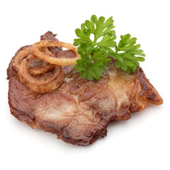 Cooked fried pork meat with parsley herb leaves and onion slices