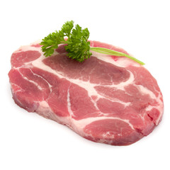 Fototapeta premium Raw pork neck chop meat with parsley herb leaves garnish isolate