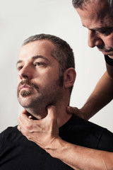 Fototapeta premium Kapap instructor shows the critical points. Pressure points figh