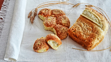 Bread and boiled cow's milk on waffle towel embroidered with the Russian concept of rural dinner in the village, food from nature