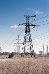 High voltage pylons on the background of nature.