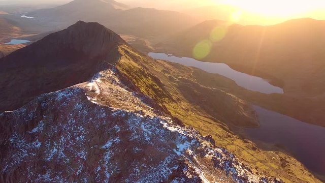 Sunrise in Snowdonia. Aerial view high over Crib Goch in Wales.