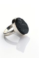 silver ring with oval onyx on a white background 1