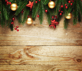 Christmas fir tree with decoration on a wooden board