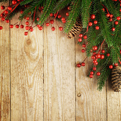 Christmas fir tree with decoration on a wooden board