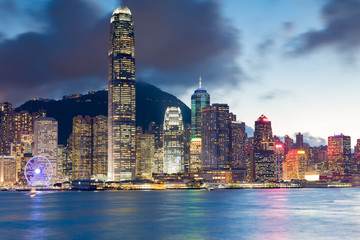 Hong Kong office building night lights over Victoria bay