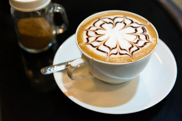 Cappuccino cup on dark background