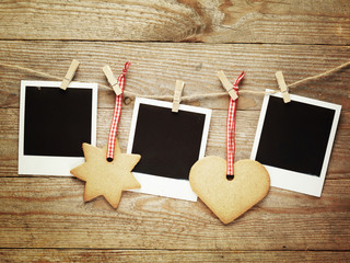 Vintage photo frames decorated for Christmas on the wooden board