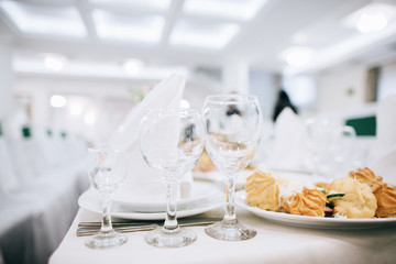 Table set for an event party or wedding reception. Food and drink