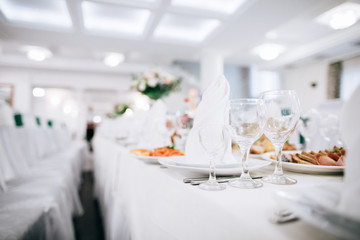 Table set for an event party or wedding reception. Food and drink