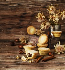small round Christmas cakes with nuts and cinnamon, space for text
