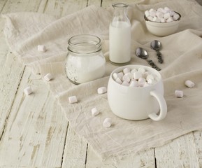 white cup with cocoa and marshmallows, selective focus