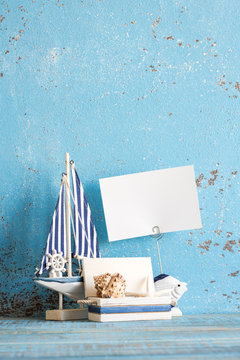 Decorative marine items on wooden background.