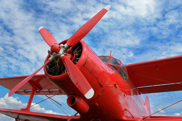 Red airplane biplane with piston engine