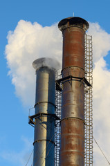 The smoke from industrial chimneys.