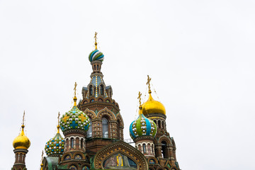 Fototapeta na wymiar Domes of Church on spilled Blood in St. Petersburg, Russia.