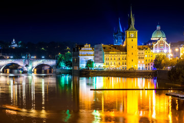 Fototapeta na wymiar View of the Vltava river and Charles Bridge at dusk. Prague, Czech Republic