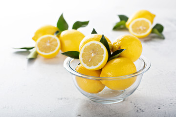 Fresh lemons in a glass bowl
