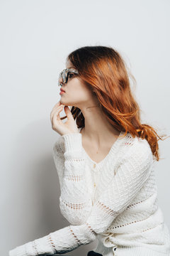 red-haired woman with glasses, profile