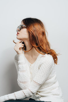 red-haired woman with glasses, profile