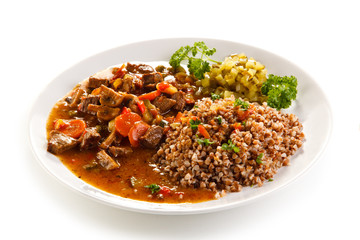 Roasted meat, white grits and vegetables