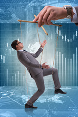 Businessman puppet being manipulated by boss