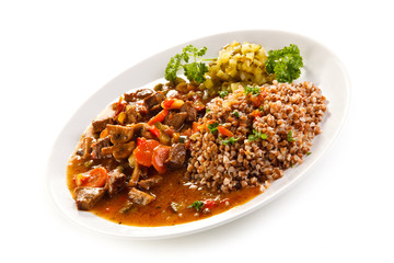 Roasted meat, white grits and vegetables