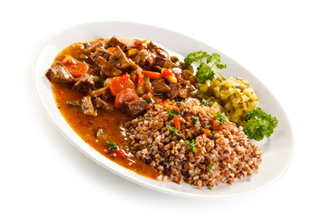Roasted meat, white grits and vegetables
