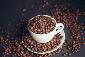 coffee beans, black background, cup, saucer