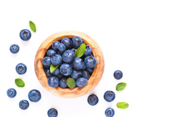Fresh blueberriaes in wooden bowl.