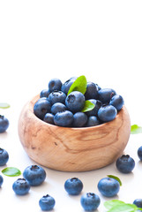 Fresh blueberriaes in wooden bowl.