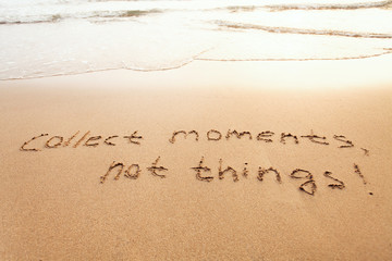 collect moments, not things - happiness concept, happy lifestyle inspirational quote, enjoy the life, text on sand