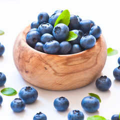 Fresh blueberriaes in wooden bowl.