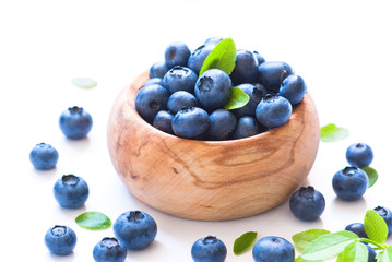 Fresh blueberriaes in wooden bowl.