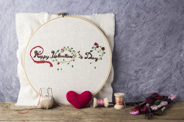 Valentine embroidery and equipment on wood table