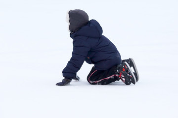 Fototapeta na wymiar the teenager fell while skating on ice