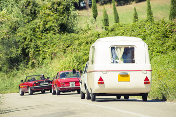 Vintage cars with old caravan