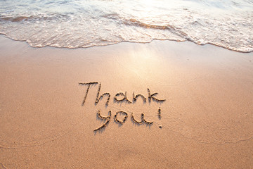 Fototapeta na wymiar thank you, gratitude concept, beautiful card, word written on sand beach