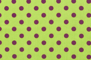 Yellow background in a purple polka dots.