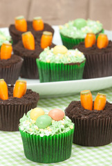 Easter Cupcakes. Homemade. Decorated With Candy Carrots, Chocola
